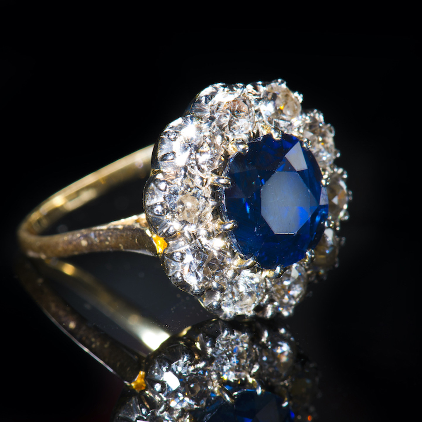 An 18Ct Gold Ring Set With A Natural Untreated Sapphire Surrounded By Diamonds. Sold For £5,000