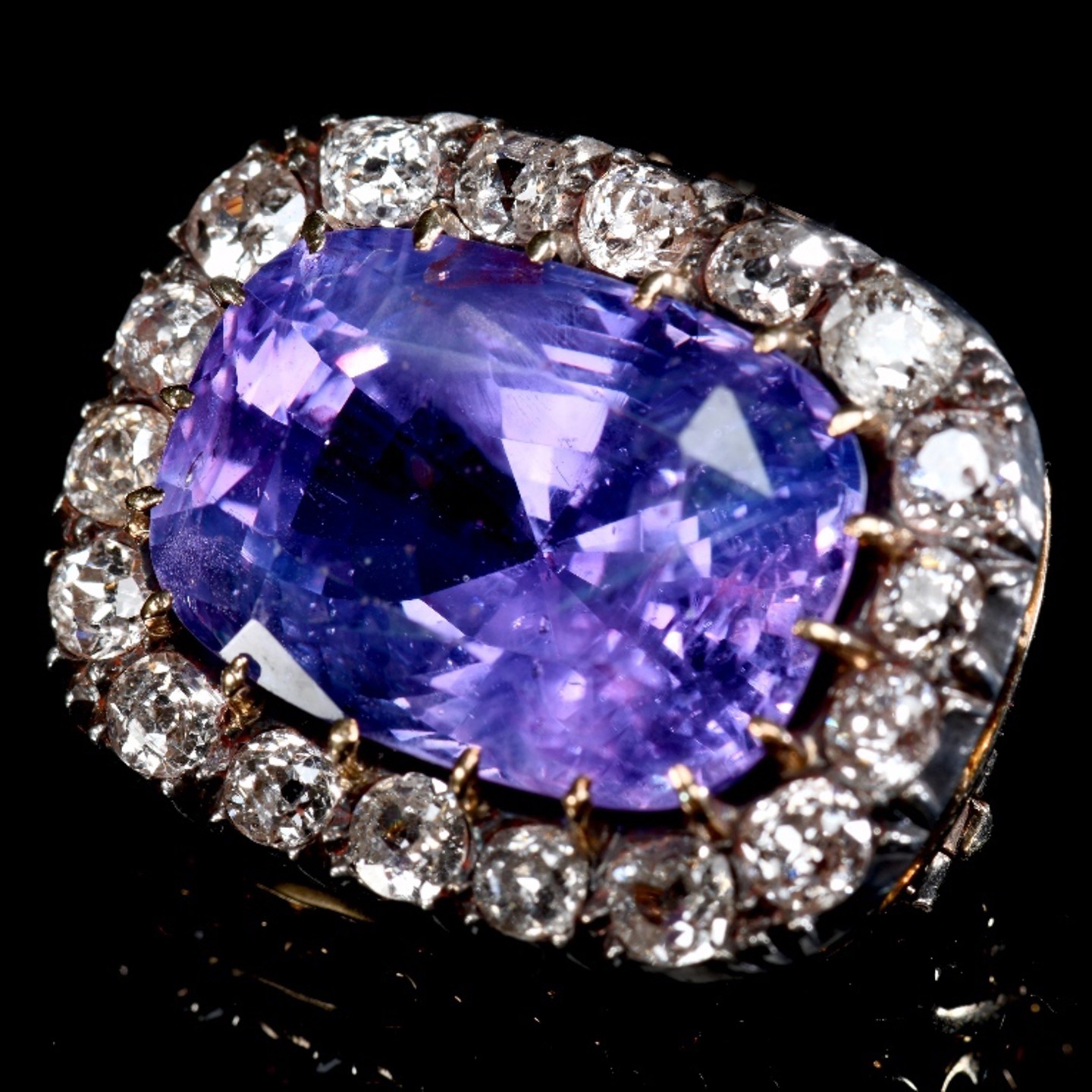 A Victorian Brooch Set With A Cushion Cut Natural, Purple Sapphire Surrounded By Old Cut Diamonds, Sold For £16,000